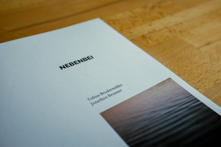 Close-up of the Nebenbei cover with the authors' names
