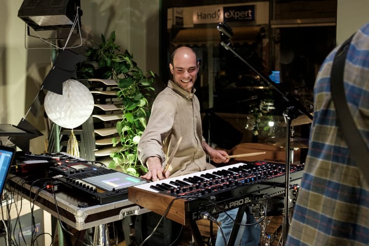 Tobi smiling at the keyboard during a session
