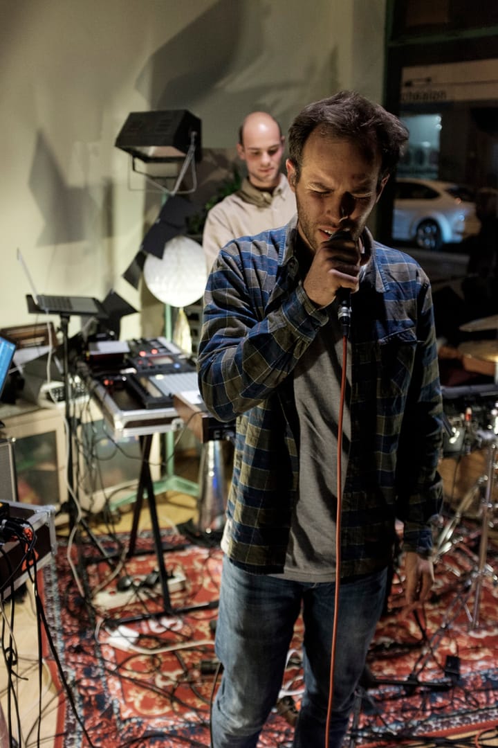 The singer at the microphone, Tobi behind him