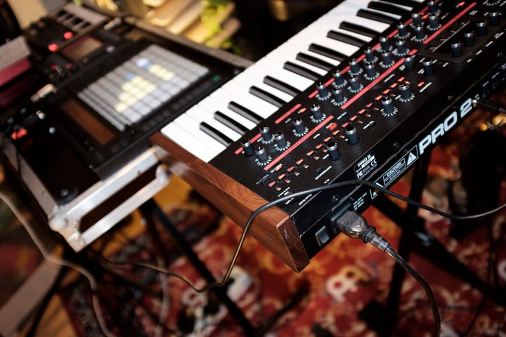 Close-up of a synthesizer and a pad controller